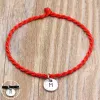 Bracelet couple initial rouge cordon tibétain